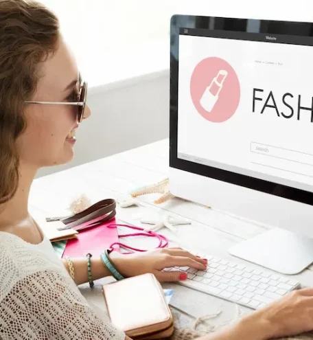 Woman browsing apparel online with category-focused marketing.
