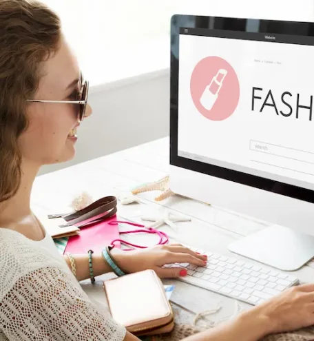 Woman browsing apparel online with category-focused marketing.
